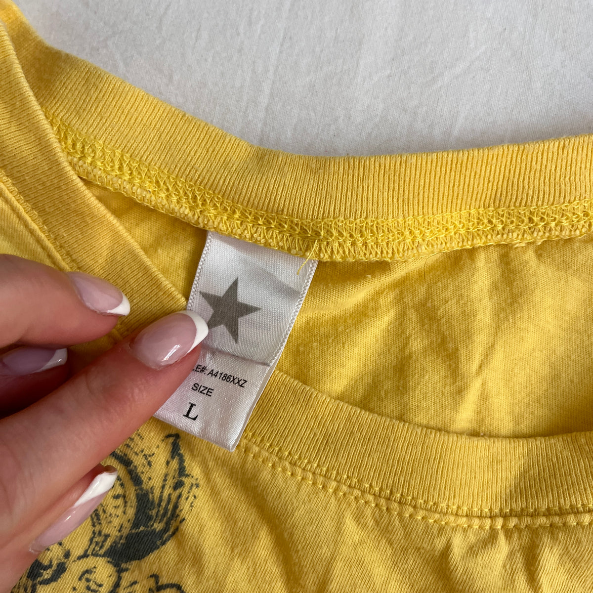 grungy yellow cross baby tee